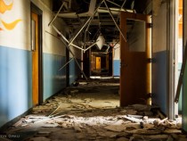 Finally a new school for the yearbook. This one was only recently abandoned (sometime in 2009 or 2010), but has been ravaged by scrappers and thieves quite badly. Most everything has been ripped off the walls or out of the ceilings, but the artwork and some small bits remain that...